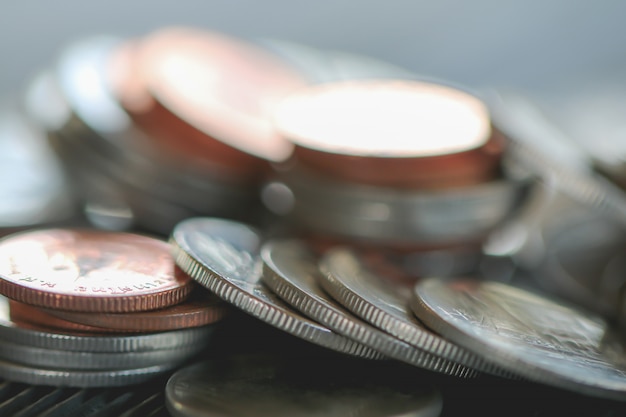 Row of coins on wood background for finance