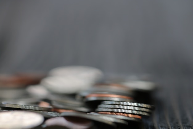 Row of coins on wood background for finance