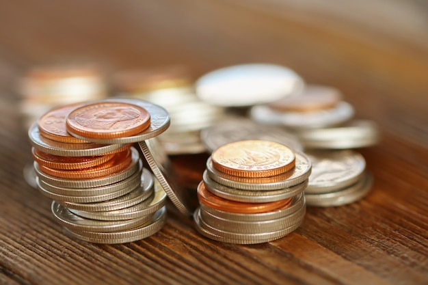 Row of coins on wood background for finance