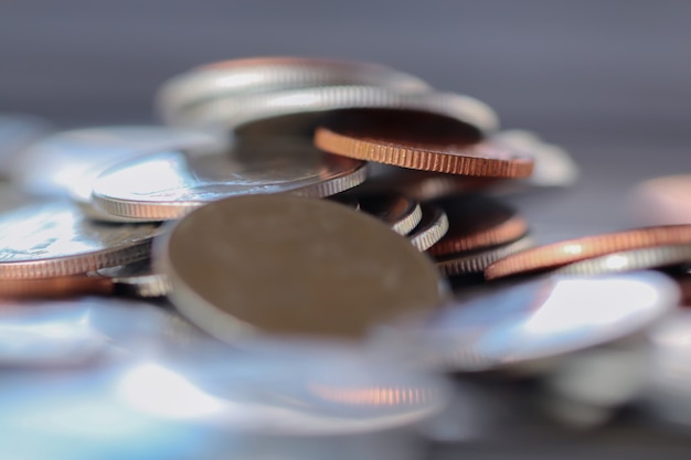 Row of coins on wood background for finance