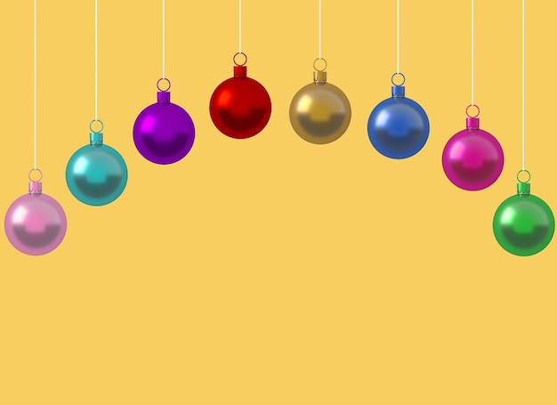 Photo row colorful christmas ball ornament hanging on yellow background. minimal holiday concept