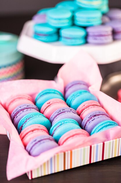 Row of colorful french macaroons in the box.