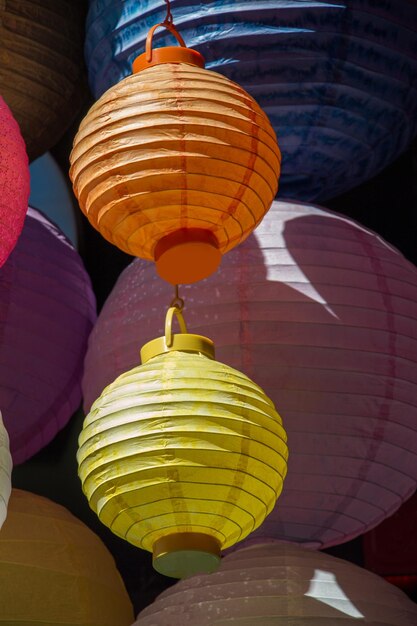 A row of colorful lanterns with the word lantern on them