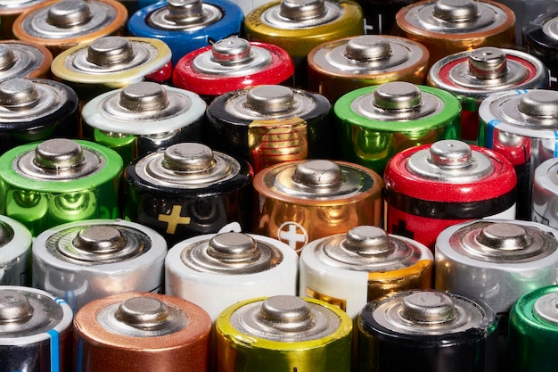 Row colorful used batteries. Recycling concept. Close-up photography.