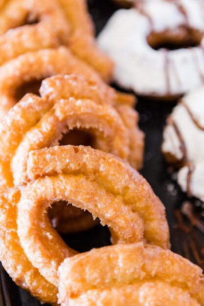 Row of fresh donuts from the local bakery shop.