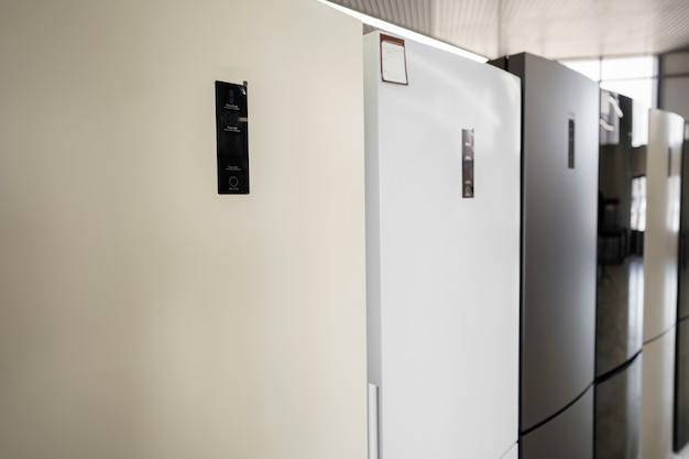 Row of fridges in household appliances store