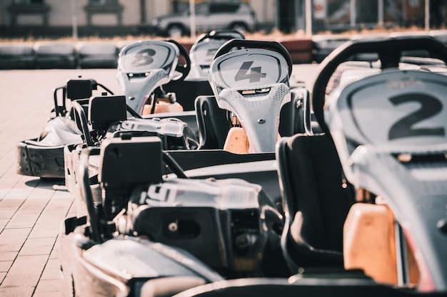 Row of go carts at the track and ready to start