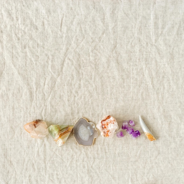 Row of healing crystals Gemstones for magic crystal ritual chakra relaxation reiki healing therapy