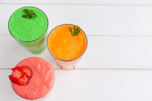 Row of healthy fresh fruit and vegetable smoothies