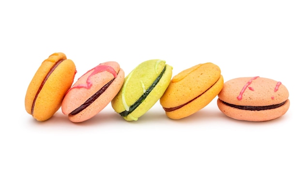 Row of macaroons on white background