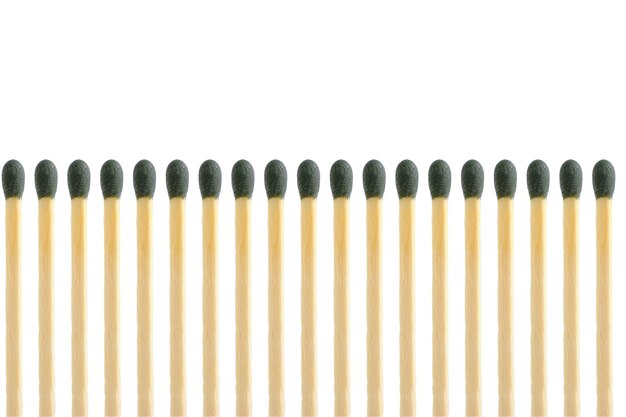 Row of matches light background closeup