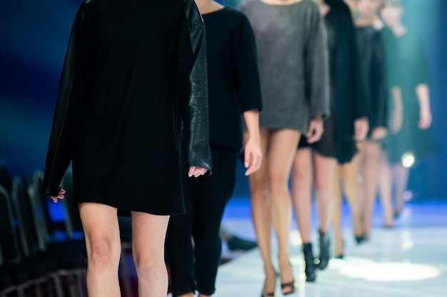 row of models practicing for fashion show