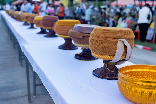 Row of monk's alms-bowl on a Buddhist day.