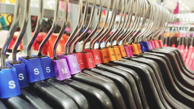 Photo row of multi colored hanger in store