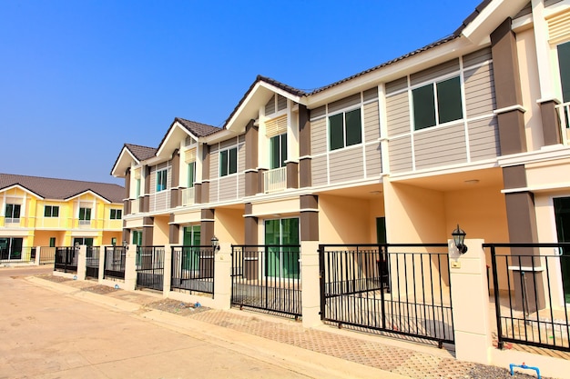 A row of new townhouses with colorful paint