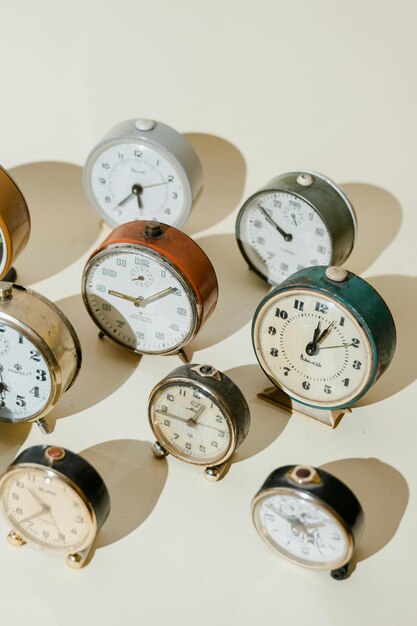 a row of old clocks with the time as 12  15