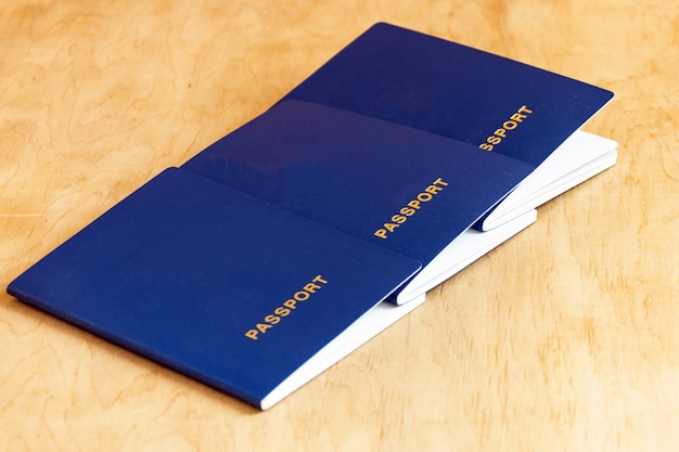 Photo row of passports on wooden background