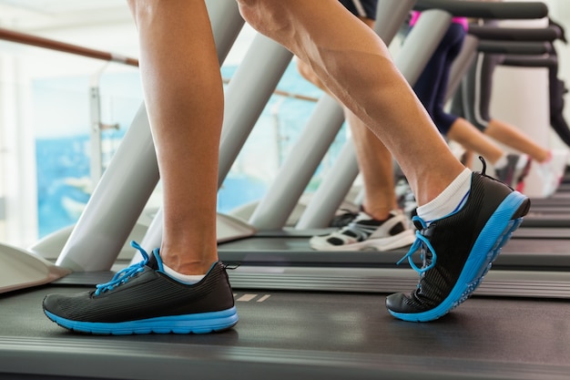 Row of people working out on treadmills