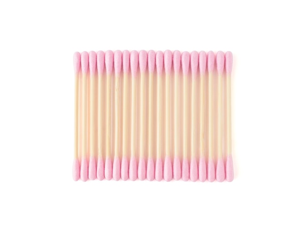 Row of pink recyclable bamboo cotton buds isolated on white background