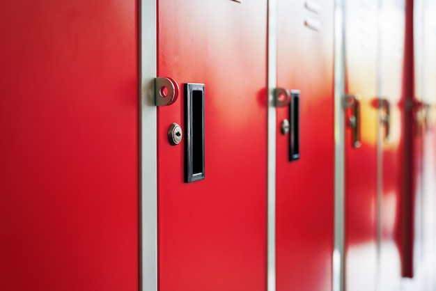 Row of red metal lockers in locker room