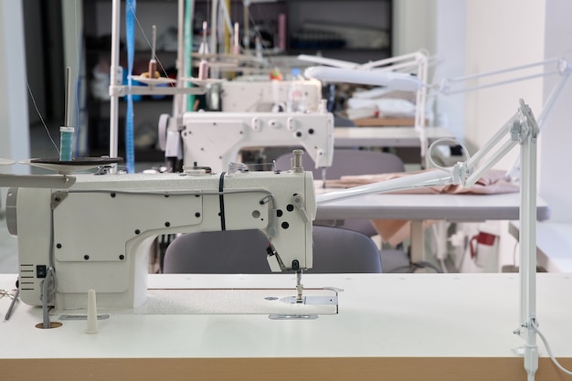 Row of sewing machines in tailor shop