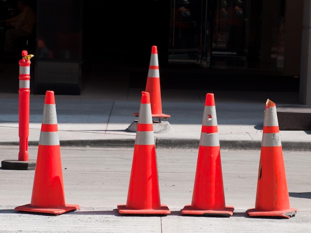 Photo row of traffic cones in  downtown denver, colorado.