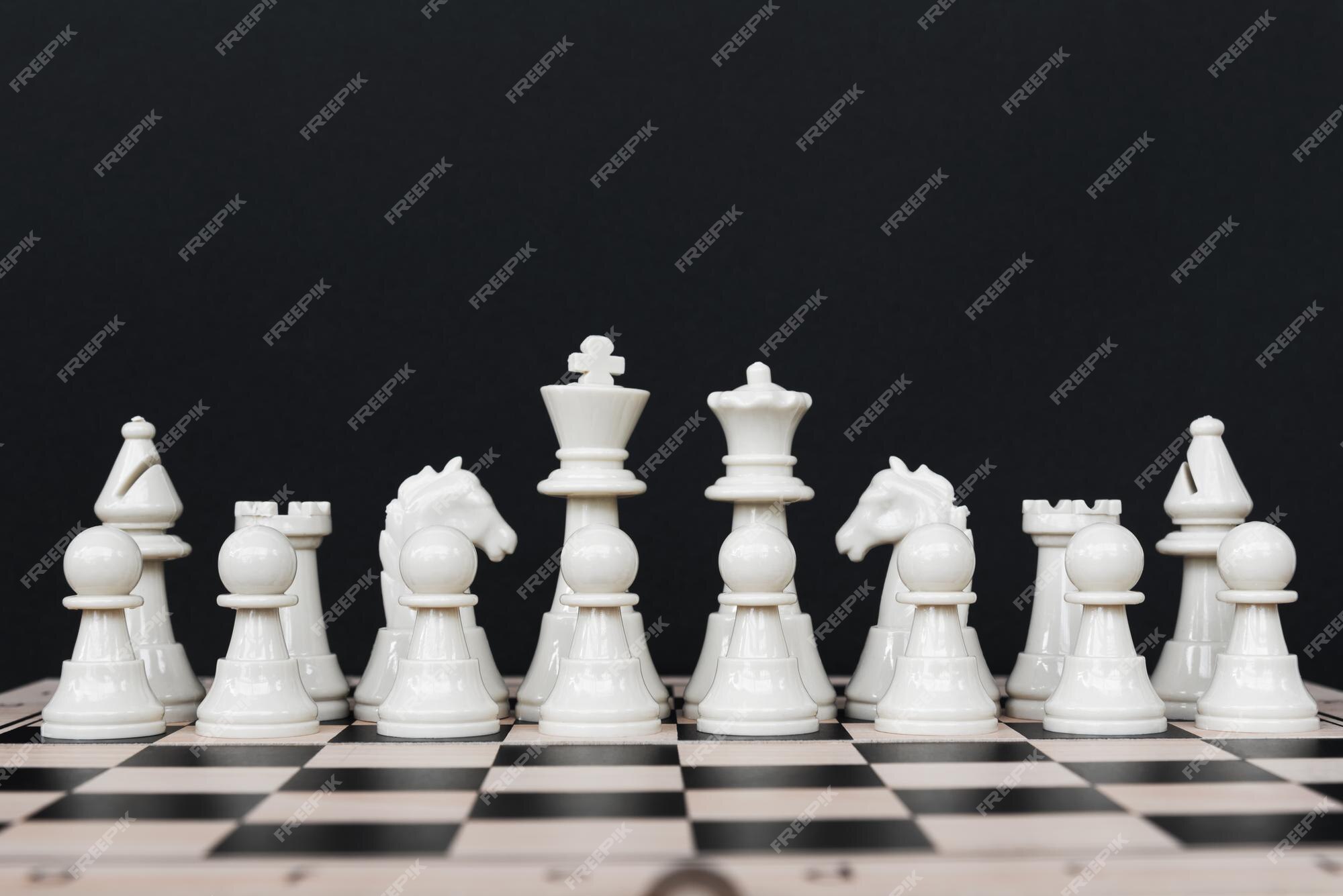 White chess piece on black table photo – Free Dubai - united arab emirates  Image on Unsplash