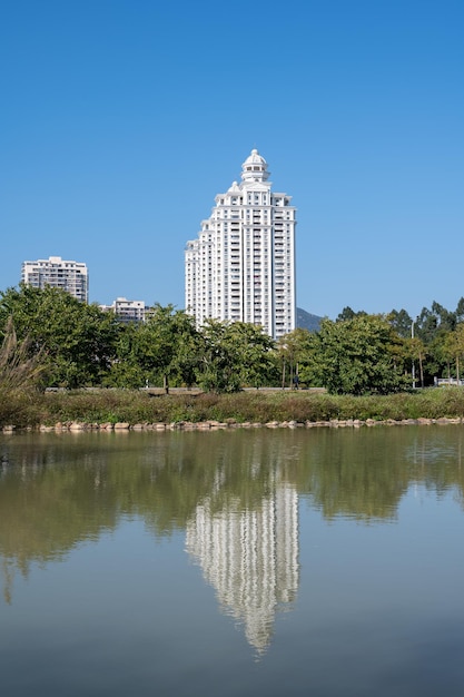 A row of white European style buildings are under the blue sky