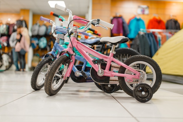 Rows of children's bicycles in sports shop