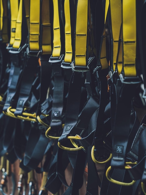 Rows of climbing safety ropes and carabiners and helmets