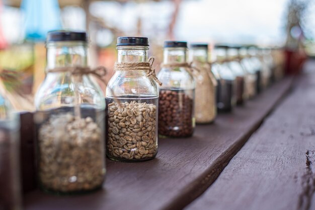 Rows of coffee in glass bottles Concept of different types of coffee