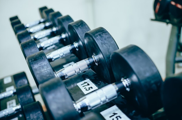 Rows of dumbbells in the gym