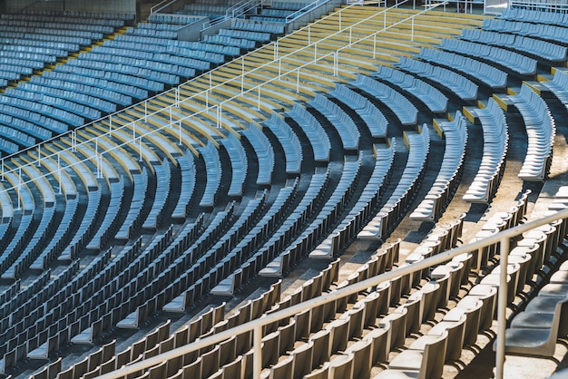 Rows of empty seats of a large stadium