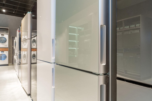 rows of fridges in household appliance store