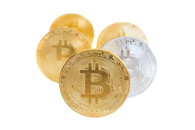 Rows of golden and silver bitcoins isolated on white background. Electronic money mining concept