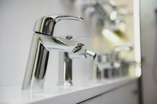 Rows of new faucets in a plumbing shop