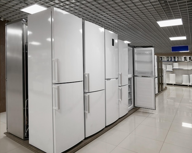 Rows of refrigerators in home appliance and electronics store The choice of refrigerators for buyers