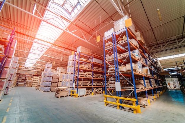 Rows of shelves with boxes in modern warehouse Big pile of boxes in distribution warehouse Closeup