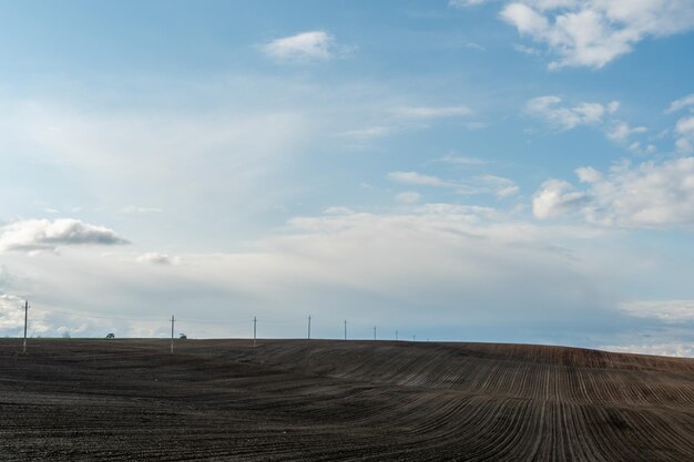 Rows of soil before planting Drawing of furrows on a plowed field prepared for spring sowing of agricultural crops View of the land prepared for planting and growing crops