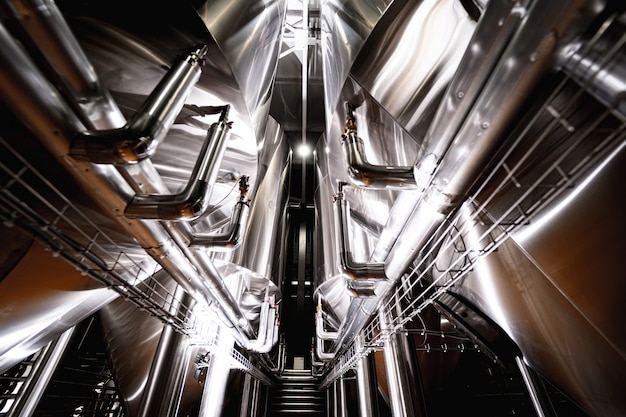 Rows of steel tanks for beer fermentation and maturation in a craft brewery