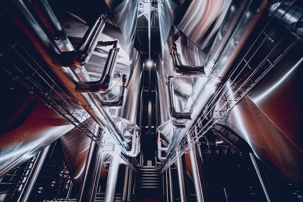 Rows of steel tanks for beer fermentation and maturation in a craft brewery