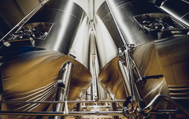 Rows of steel tanks for beer fermentation and maturation in a craft brewery