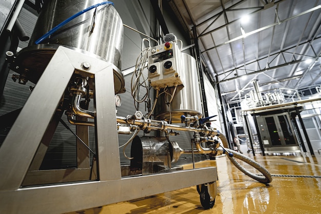 Rows of steel tanks for beer fermentation and maturation in a craft brewery