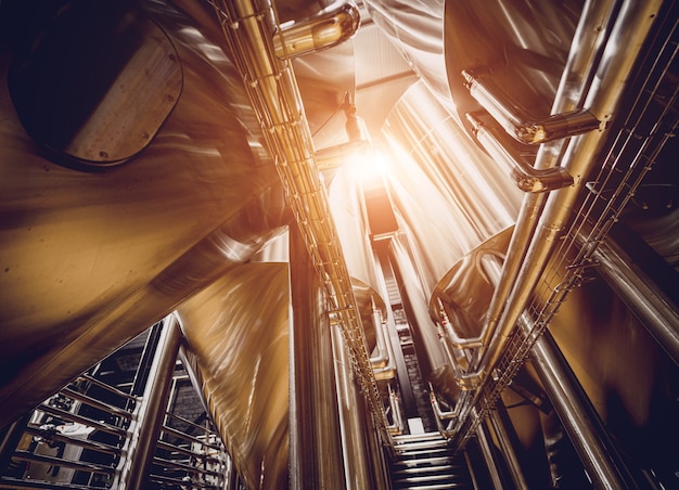 Rows of steel tanks for beer fermentation and maturation in a craft brewery