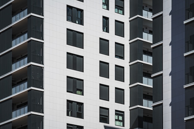 Rows of windows and balconies of residential buildings