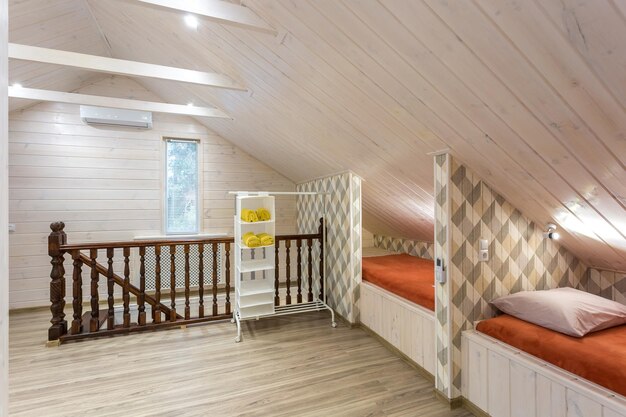 Rows of wooden beds in a modern eco hostel with amenities