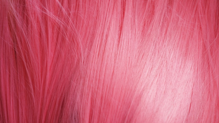 Foto roze haar pruik close-up textuur. kan worden gebruikt als achtergrond