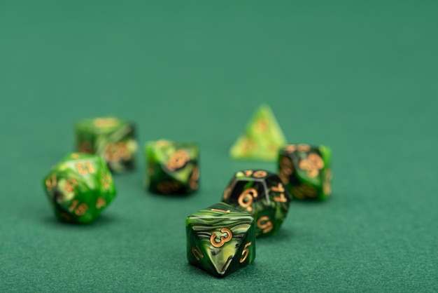 Rpg dice beautiful rpg dice placed on green felt surface selective focus