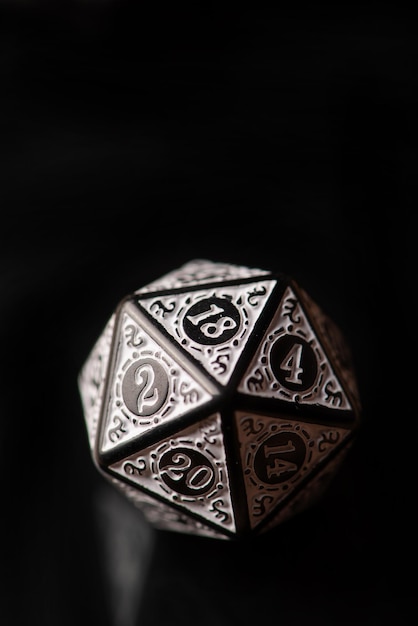 RPG dice beautiful RPG game dice in detail on reflective surface selective focus