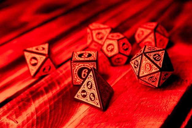 RPG dice illuminated with colored light light painting style photo selective focus